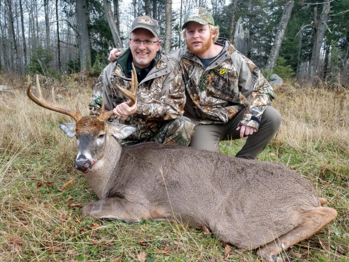 Man and guide with buck