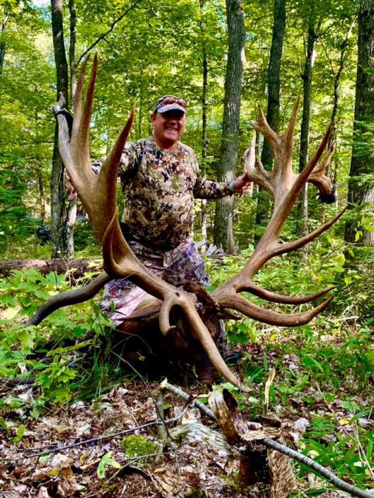 man with elk kill