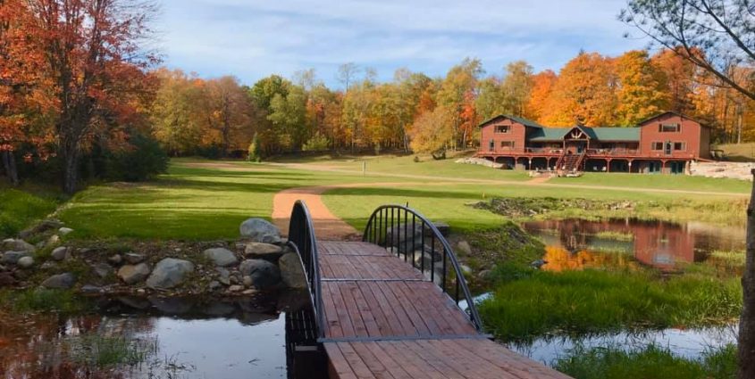 Vacation Rentals in Phelps Lodge Exterior with Bridge