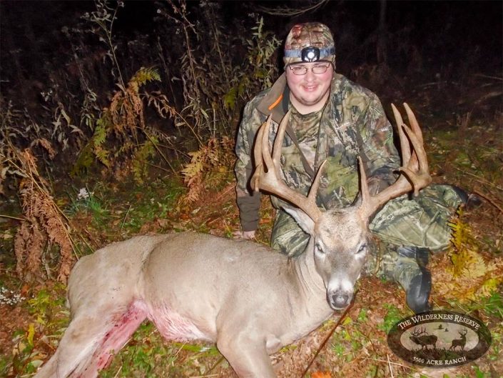 a hunter with a buck 