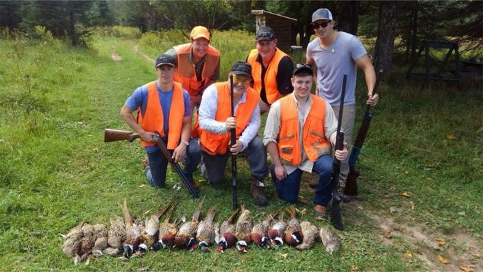 a group of hunters with their pheasant harvest 