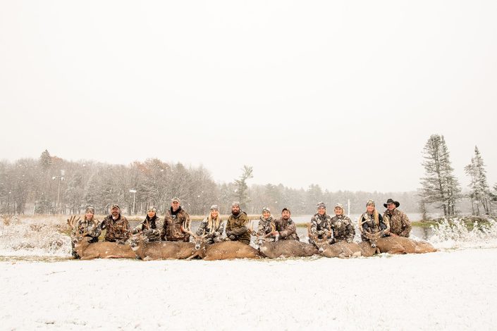 Group with trophy animals after hunting retreat